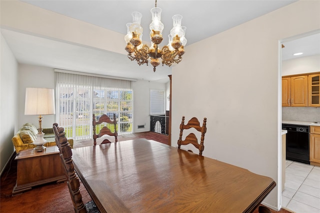 dining area with recessed lighting, light tile patterned floors, and a chandelier