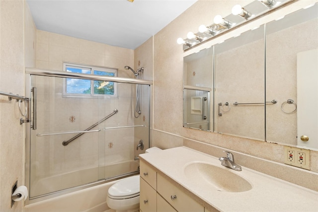 bathroom with shower / bath combination with glass door, toilet, and vanity