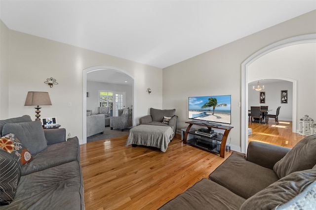 6 Fountayne Ct, Washingtonville, NY 10992 - living area with an inviting chandelier, light wood-style floors, and arched walkways