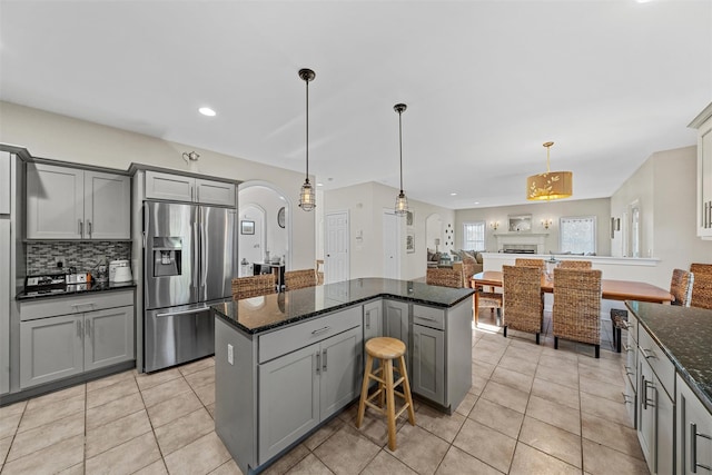 6 Fountayne Ct, Washingtonville, NY 10992 - kitchen with gray cabinetry, light tile patterned floors, stainless steel refrigerator with ice dispenser, and backsplash