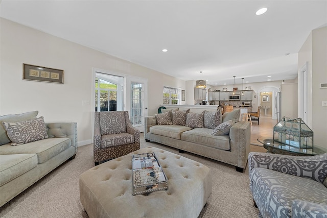 6 Fountayne Ct, Washingtonville, NY 10992 - living room featuring recessed lighting, arched walkways, light carpet, and baseboards