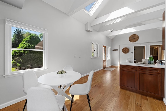 200 Fort Hill Rd, Scarsdale, NY 10583 - dining area with a skylight, plenty of natural light, baseboards, and high vaulted ceiling