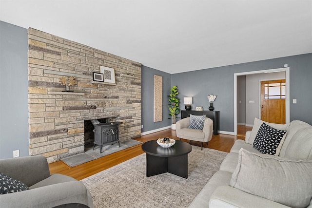 200 Fort Hill Rd, Scarsdale, NY 10583 - living room with a wood stove, wood finished floors, and baseboards