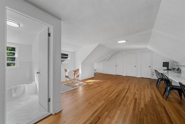 200 Fort Hill Rd, Scarsdale, NY 10583 - bonus room with lofted ceiling, light wood finished floors, and a textured ceiling