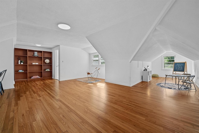 200 Fort Hill Rd, Scarsdale, NY 10583 - additional living space featuring wood finished floors, vaulted ceiling, and baseboards