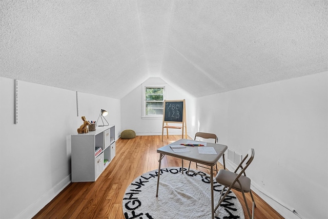 200 Fort Hill Rd, Scarsdale, NY 10583 - office featuring a textured ceiling, baseboards, light wood-style floors, and vaulted ceiling