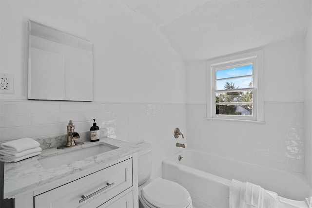 200 Fort Hill Rd, Scarsdale, NY 10583 - full bathroom featuring toilet, a bath, vaulted ceiling, vanity, and tile walls