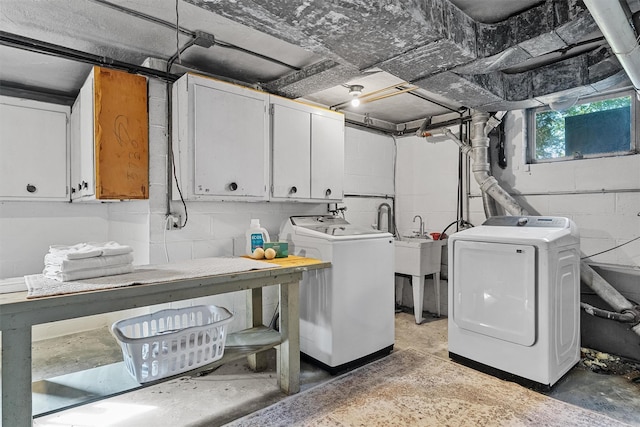 200 Fort Hill Rd, Scarsdale, NY 10583 - laundry area featuring cabinet space, washing machine and clothes dryer, and concrete block wall
