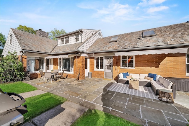 200 Fort Hill Rd, Scarsdale, NY 10583 - rear view of house featuring outdoor lounge area, brick siding, a patio area, and a chimney
