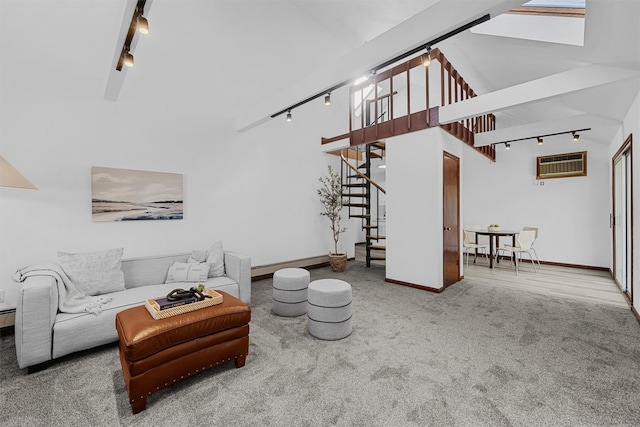 200 Fort Hill Rd, Scarsdale, NY 10583 - living area with track lighting, an AC wall unit, stairway, high vaulted ceiling, and carpet flooring