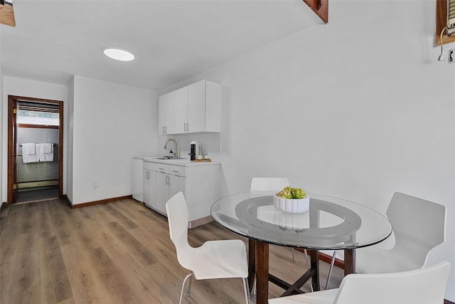 200 Fort Hill Rd, Scarsdale, NY 10583 - dining area with light wood finished floors and baseboards