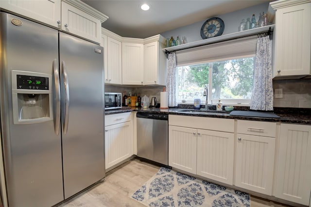 25 Evergreen Rd, Putnam Valley, NY 10579 - kitchen with backsplash, stainless steel appliances, light wood-type flooring, and a sink