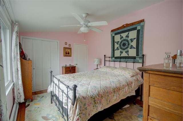 25 Evergreen Rd, Putnam Valley, NY 10579 - bedroom with vaulted ceiling, a baseboard heating unit, light wood-style floors, a closet, and ceiling fan