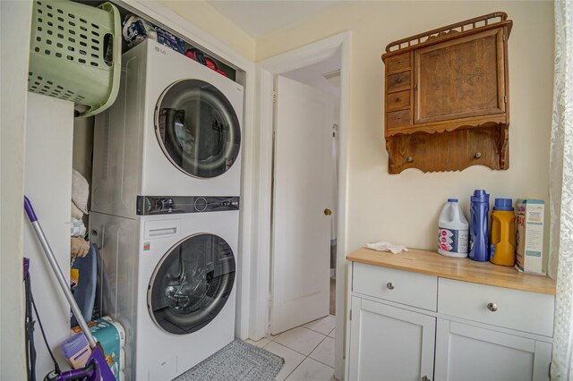 25 Evergreen Rd, Putnam Valley, NY 10579 - laundry room with stacked washer / dryer, laundry area, and light tile patterned floors