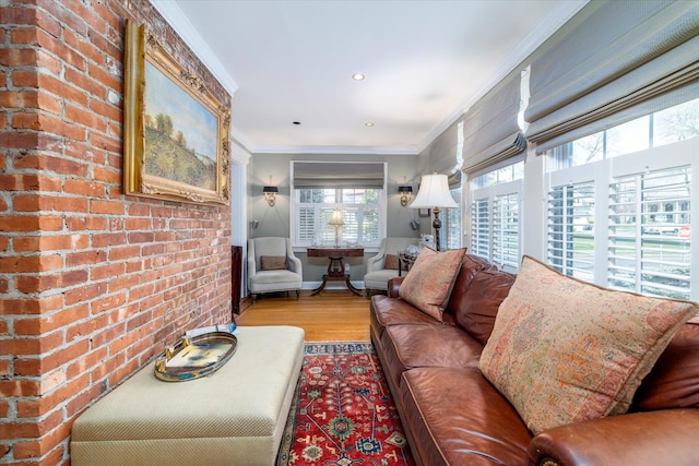 169 Hempstead Ave, Rockville Centre, NY 11570 - living room with brick wall, crown molding, wood finished floors, and recessed lighting