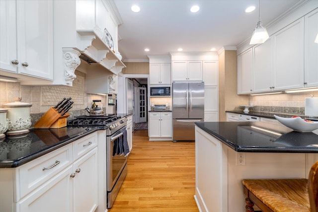169 Hempstead Ave, Rockville Centre, NY 11570 - kitchen with light wood finished floors, tasteful backsplash, appliances with stainless steel finishes, and white cabinetry