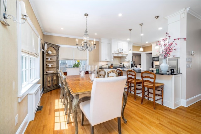 169 Hempstead Ave, Rockville Centre, NY 11570 - dining area with recessed lighting, visible vents, light wood-style floors, baseboards, and a notable chandelier