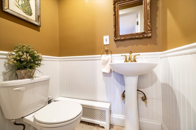 169 Hempstead Ave, Rockville Centre, NY 11570 - bathroom featuring toilet and wainscoting