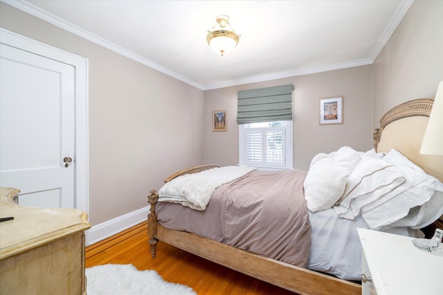 169 Hempstead Ave, Rockville Centre, NY 11570 - bedroom with baseboards, ornamental molding, and wood finished floors
