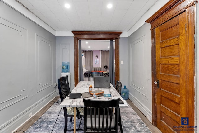 dining space with recessed lighting, baseboards, and dark wood-style flooring
