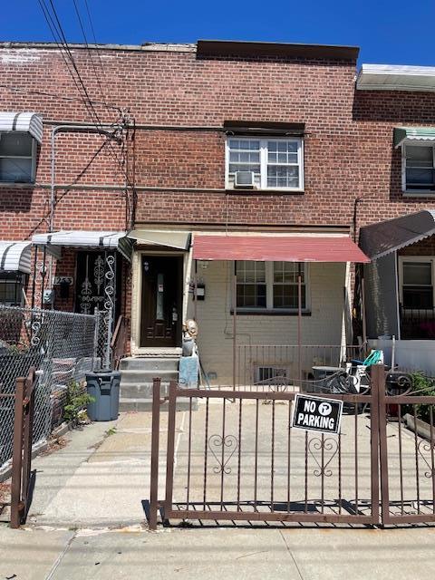 1255 E 223rd St, Bronx, NY 10466 - multi unit property with brick siding, a fenced front yard, and cooling unit