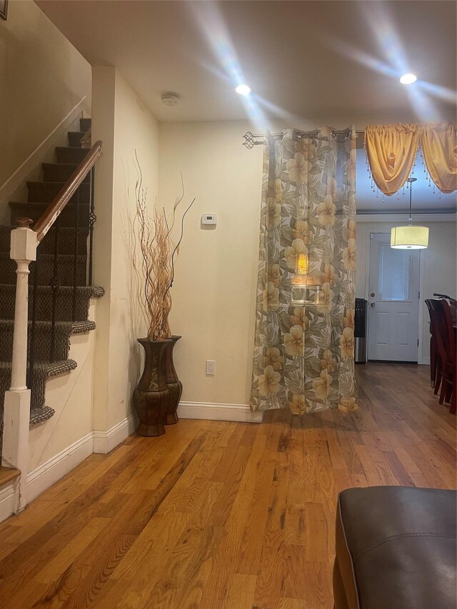 1255 E 223rd St, Bronx, NY 10466 - below grade area with baseboards, stairs, and wood finished floors