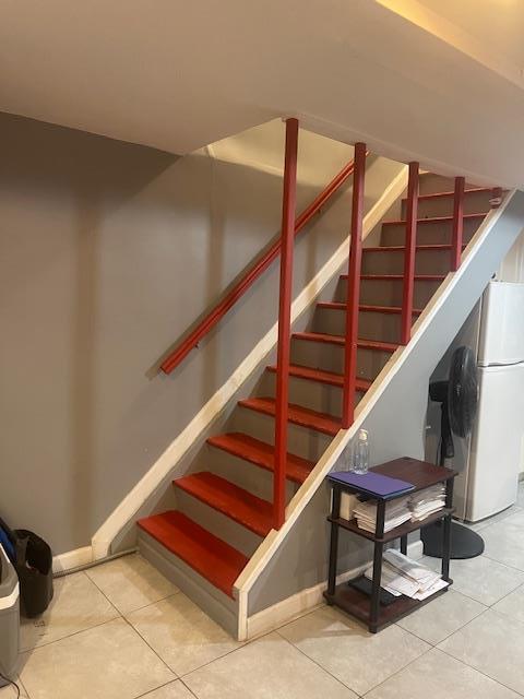 1255 E 223rd St, Bronx, NY 10466 - stairway with baseboards and tile patterned floors