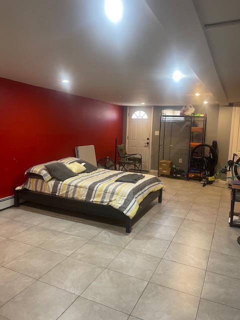 1255 E 223rd St, Bronx, NY 10466 - bedroom featuring light tile patterned floors