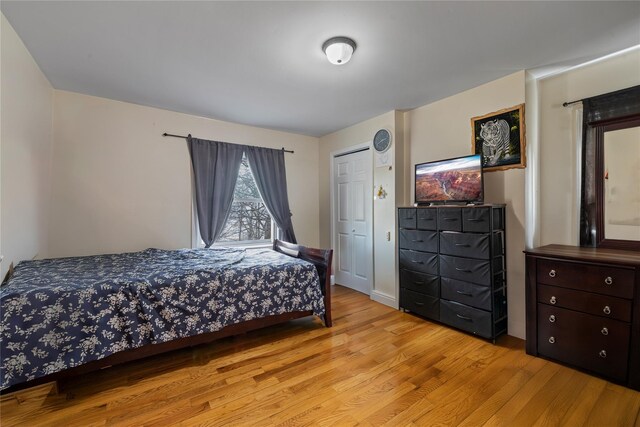 bedroom featuring a closet and wood finished floors