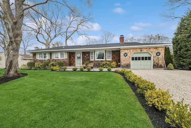 single story home featuring an attached garage, driveway, a chimney, and a front lawn