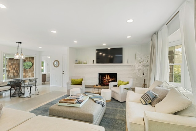 living area with a fireplace and recessed lighting