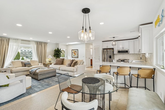 living room with recessed lighting and light tile patterned floors
