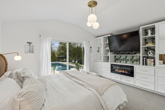 bedroom with lofted ceiling, access to exterior, and light carpet