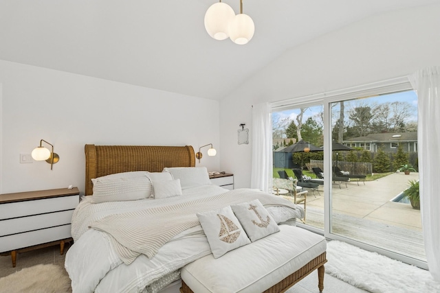 carpeted bedroom with lofted ceiling and access to exterior