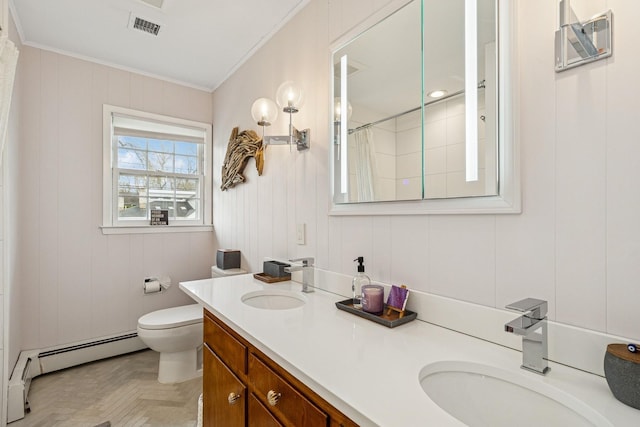 bathroom featuring toilet, ornamental molding, a sink, and visible vents