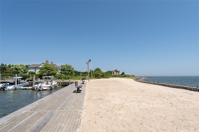 exterior space with a dock and a water view