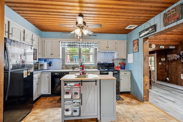 kitchen featuring plenty of natural light, visible vents, a ceiling fan, wood ceiling, and black appliances