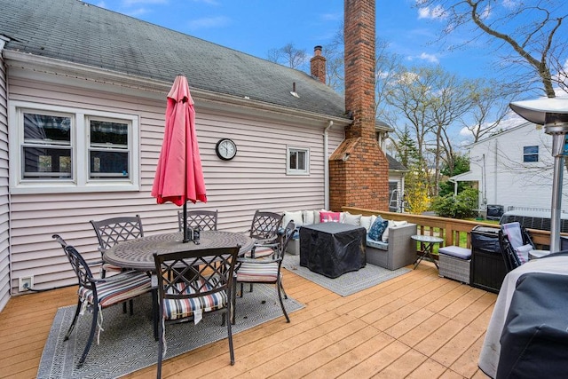 wooden deck featuring outdoor lounge area and outdoor dining space