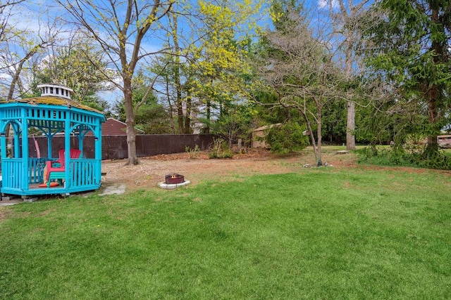 view of yard with a gazebo and fence