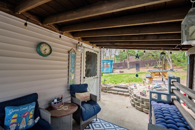 view of patio / terrace featuring fence