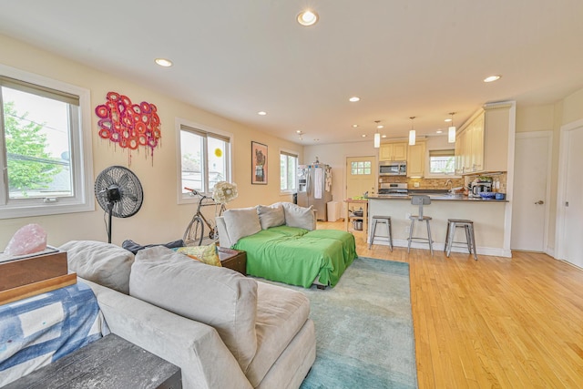 351 Bch 87th St, Rockaway Beach, NY 11693 - living room featuring plenty of natural light, recessed lighting, and light wood finished floors