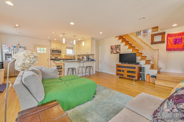 351 Bch 87th St, Rockaway Beach, NY 11693 - living area with light wood-style floors, stairs, and recessed lighting
