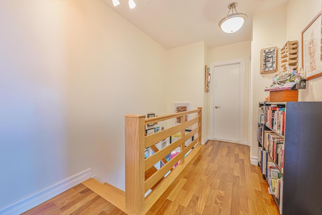351 Bch 87th St, Rockaway Beach, NY 11693 - hall with an upstairs landing and light wood finished floors