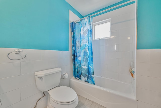 351 Bch 87th St, Rockaway Beach, NY 11693 - full bath with tile walls, shower / tub combo, and a wainscoted wall