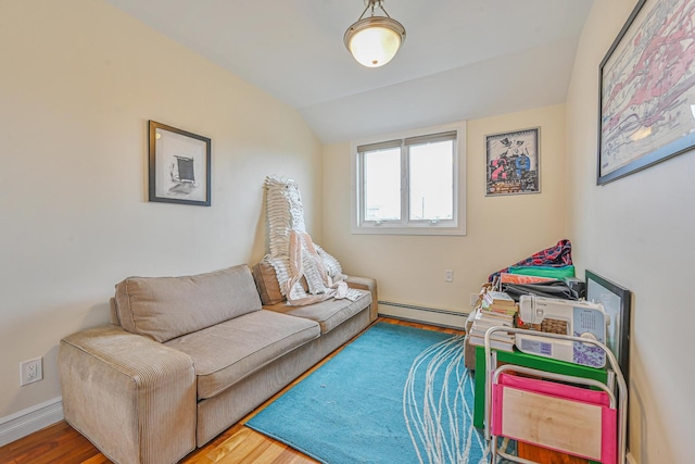 351 Bch 87th St, Rockaway Beach, NY 11693 - living area with baseboard heating, lofted ceiling, and wood finished floors