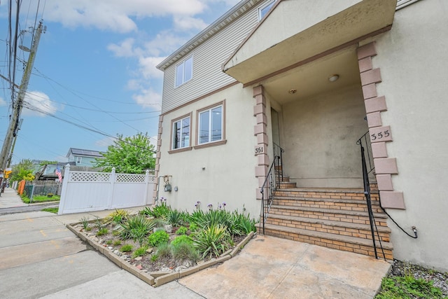 351 Bch 87th St, Rockaway Beach, NY 11693 - view of exterior entry with stucco siding