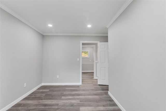 spare room with crown molding, recessed lighting, and baseboards