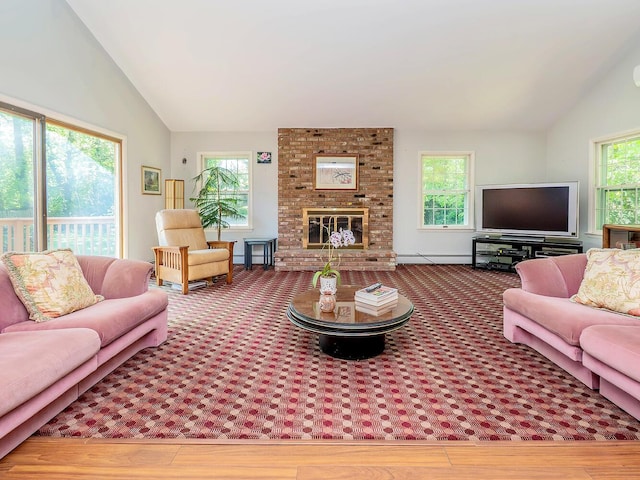 living room featuring a baseboard radiator, wood finished floors, a brick fireplace, and vaulted ceiling