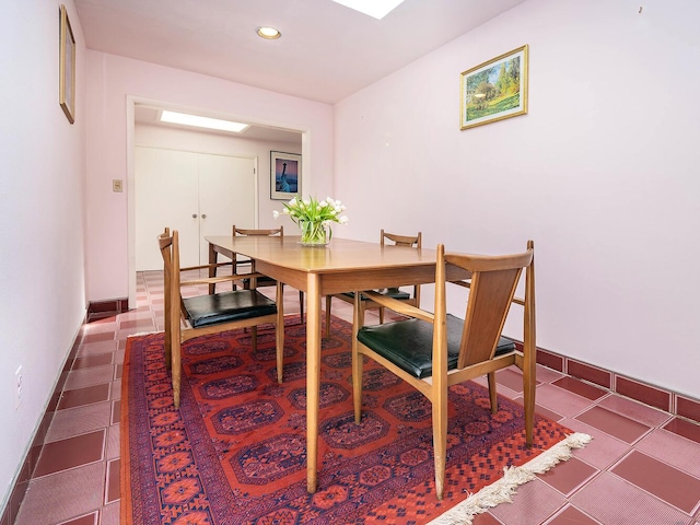 dining space with baseboards and recessed lighting