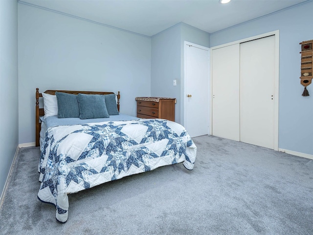 carpeted bedroom with a closet, baseboards, and recessed lighting